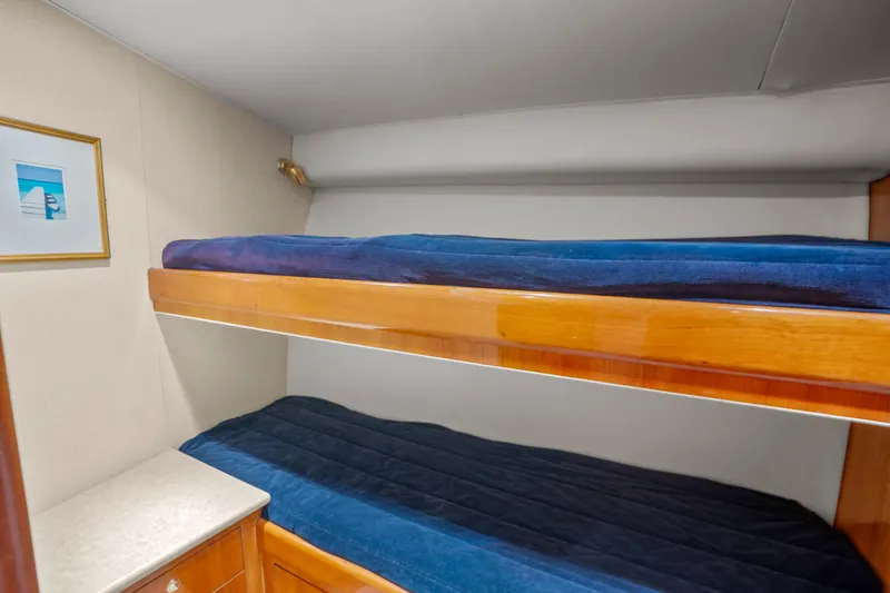Slide: The Image of Bunk beds in 2004 Sculley Custom Carolina 58' Sportfish cabin with blue bedding. - 41
