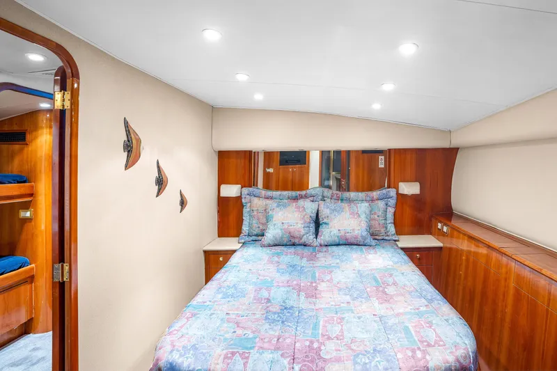 Slide: The Image of Luxurious cabin interior of 2004 Sculley Custom Carolina 58' Sportfish with cozy bedding. - 43