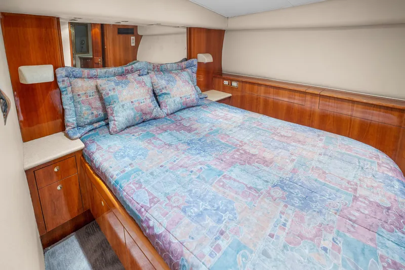 Slide: The Image of Luxurious bedroom in 2004 Sculley Custom Carolina 58' Sportfish yacht with colorful bedding. - 44