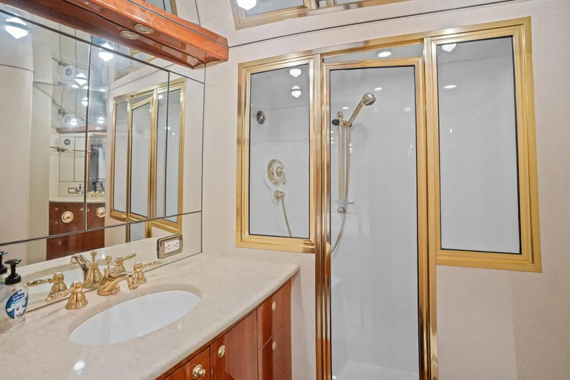 Slide: The Image of Luxurious bathroom on 2004 Sculley Custom Carolina 58' Sportfish yacht with gold accents. - 49