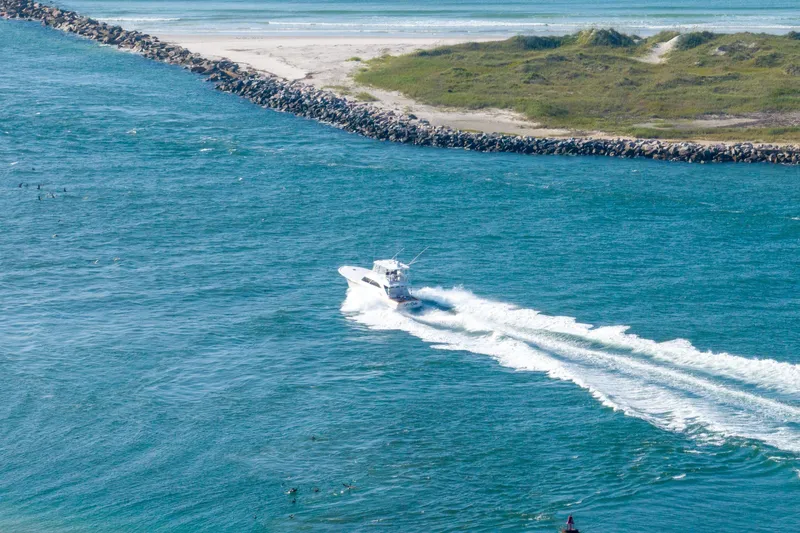 Slide: The Image of Aerial view of 2004 Sculley Custom Carolina 58' Sportfish cruising in blue waters. - 5