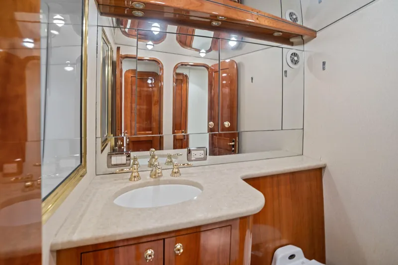 Slide: The Image of Luxurious bathroom in 2004 Sculley Custom Carolina 58' Sportfish yacht with elegant wood finishes. - 54