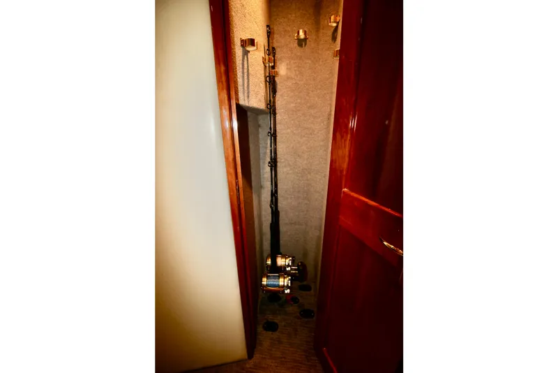 Slide: The Image of Fishing rods stored in a 2004 Sculley Custom Carolina 58' Sportfish cabin. - 58