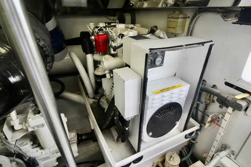 Slide: The Image of Engine room of 2004 Sculley Custom Carolina 58' Sportfish, showcasing mechanical components. - 63