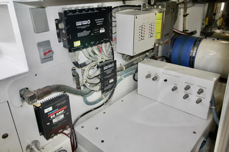 Slide: The Image of Engine room of 2004 Sculley Custom Carolina 58' Sportfish with control panels and wiring. - 64
