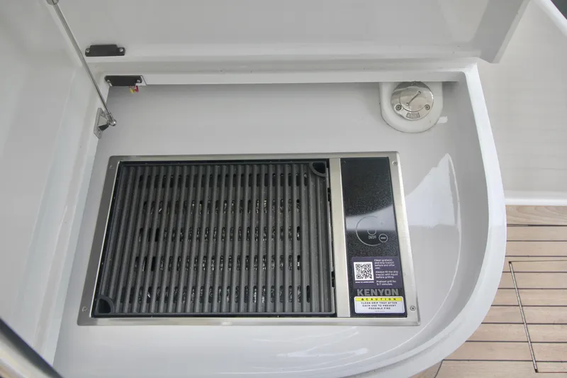 Slide: The Image of Built-in Kenyon grill on 2004 Sculley Custom Carolina 58' Sportfish yacht deck. - 71