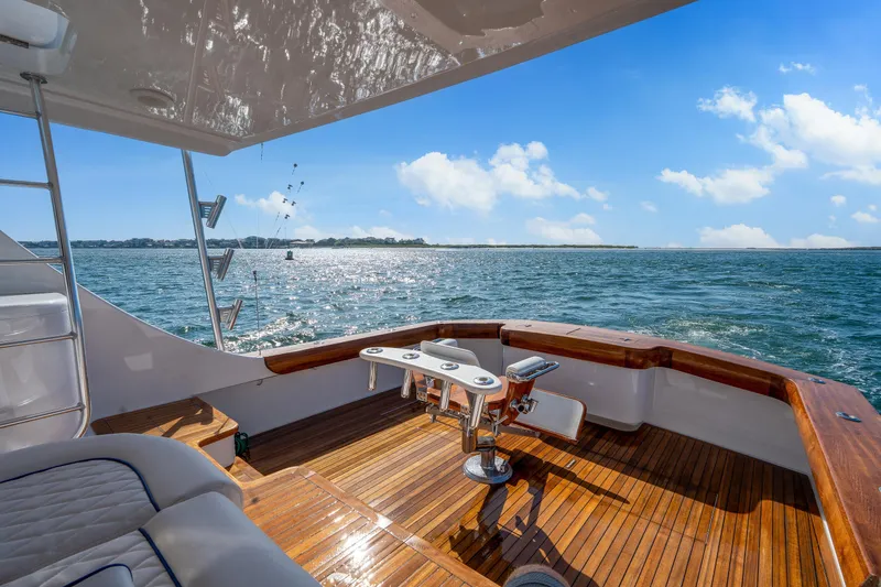 Slide: The Image of Luxurious 2004 Sculley Custom Carolina 58' Sportfish yacht on open water, sunny day. - 8