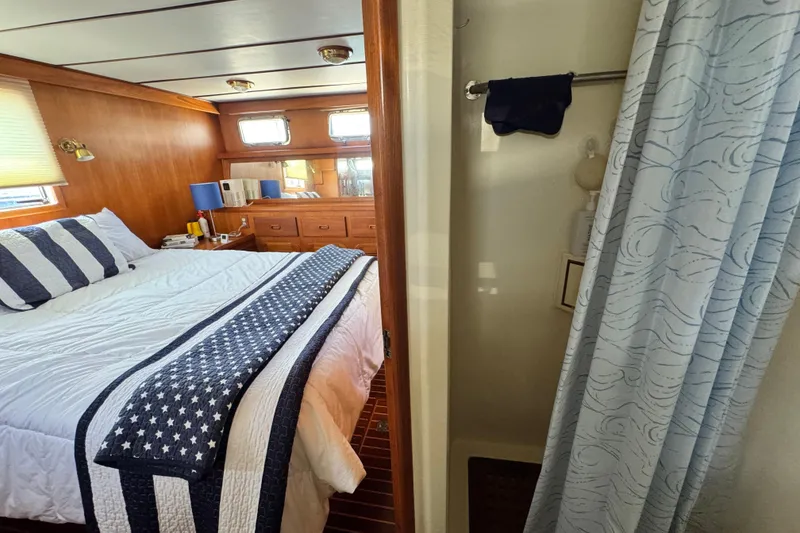Slide: The Image of Cozy bedroom and bathroom on 1999 Heritage East Sundeck 36 yacht. - 7