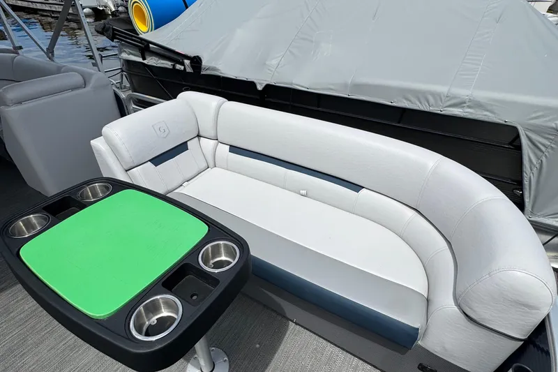 Slide: The Image of 2022 Godfrey Sweetwater 2186 C pontoon boat interior with seating and table. - 5