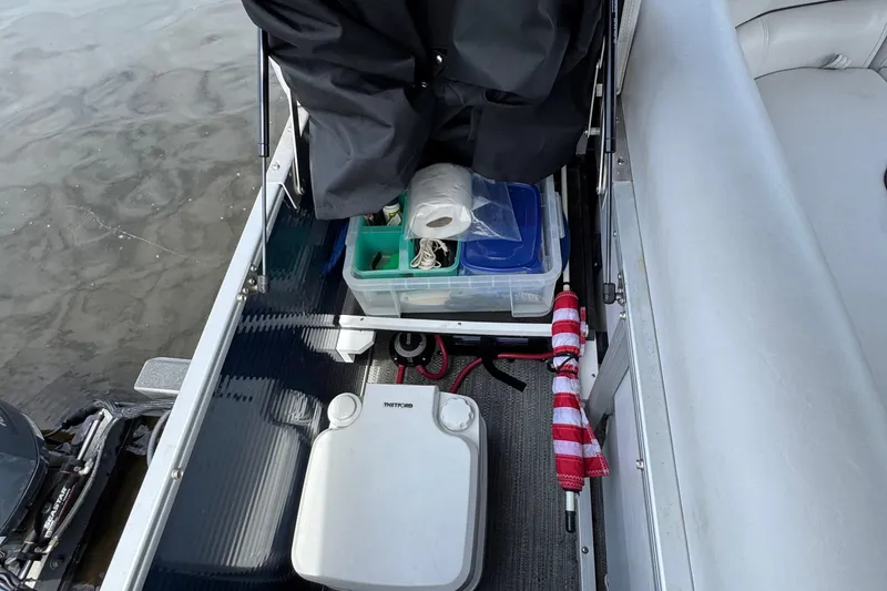 Slide: The Image of 2022 Godfrey Sweetwater 2186 C boat interior with storage items and accessories. - 8