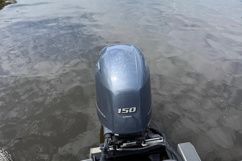 Slide: The Image of Outboard motor on 2022 Godfrey Sweetwater 2186 C pontoon boat in water. - 9