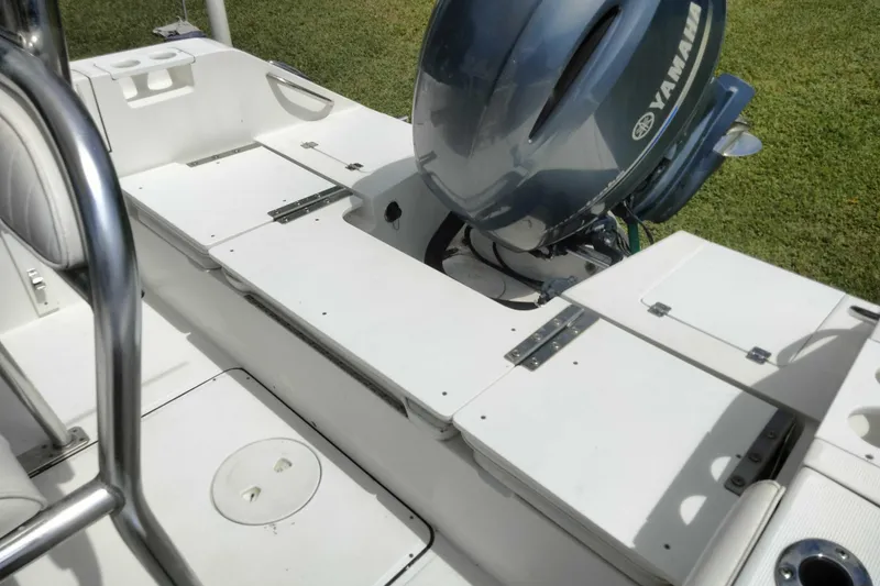 Slide: The Image of 2017 Release 208RX boat with Yamaha outboard motor, white deck, and seating area. - 12