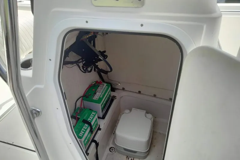 Slide: The Image of Interior of 2017 Release 208RX boat showing battery compartment and storage area. - 15