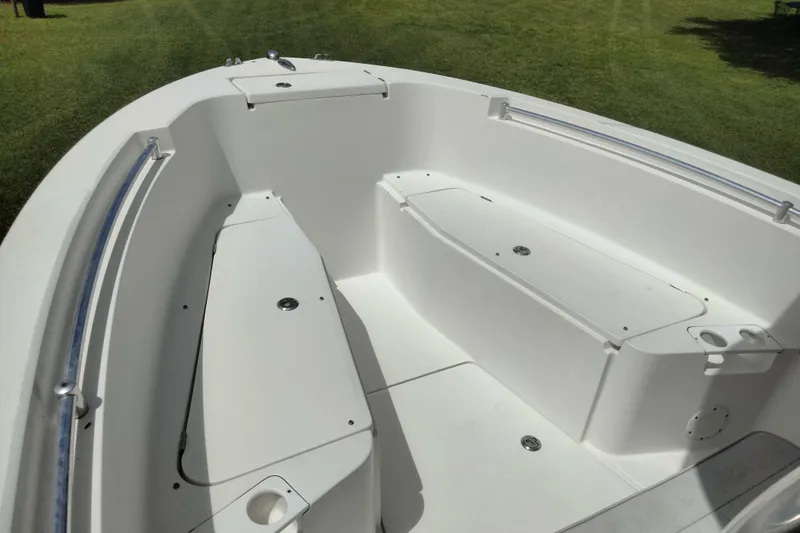 Slide: The Image of 2017 Release 208RX boat interior with white seating and storage compartments. - 17