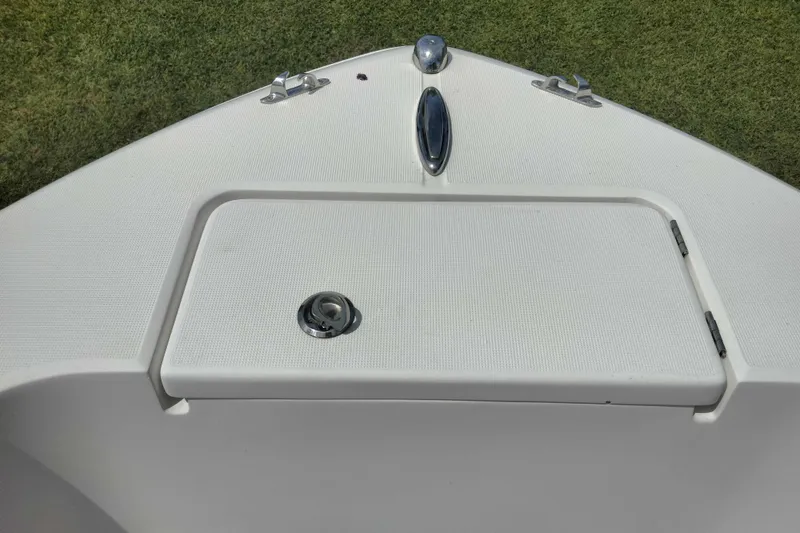 Slide: The Image of Bow of 2017 Release 208RX boat with storage compartment and cleats. - 18