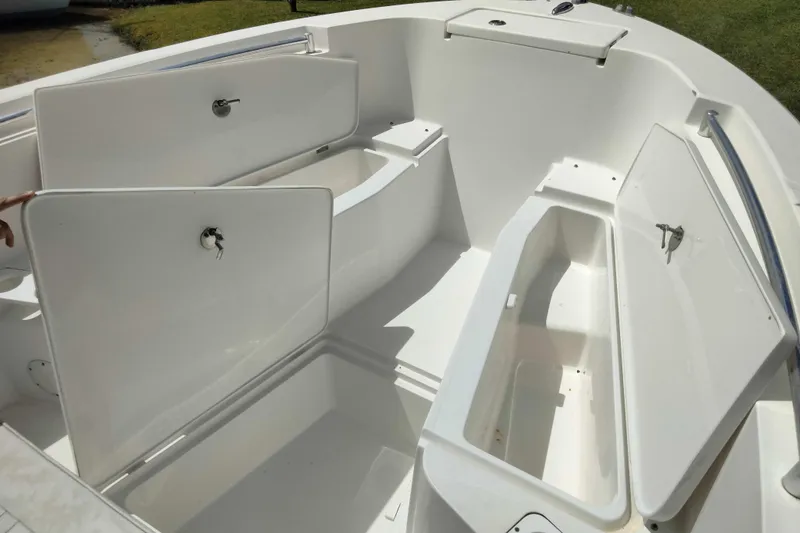 Slide: The Image of 2017 Release 208RX boat storage compartments with open hatches, showcasing spacious interior. - 20