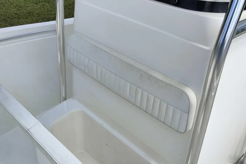 Slide: The Image of 2017 Release 208RX boat interior with white cushioned seating and stainless steel railing. - 22