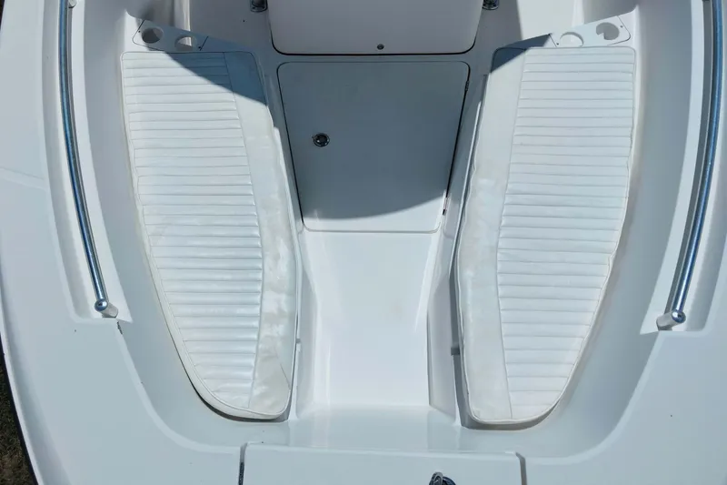 Slide: The Image of 2017 Release 208RX boat interior with white cushioned seating and stainless steel railings. - 28