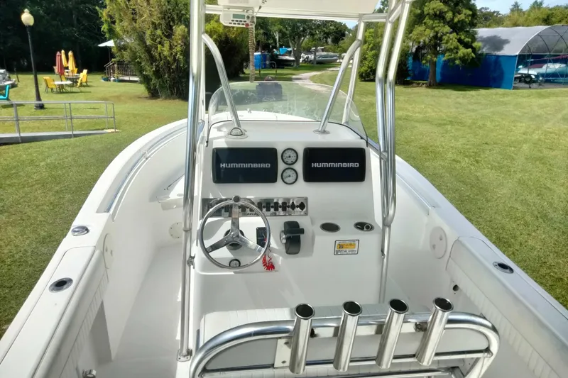 Slide: The Image of Center console of a 2017 Release 208RX boat with steering wheel and controls. - 8
