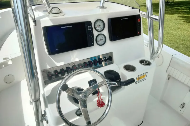 Slide: The Image of Boat console of 2017 Release 208RX with steering wheel, gauges, and navigation screens. - 9