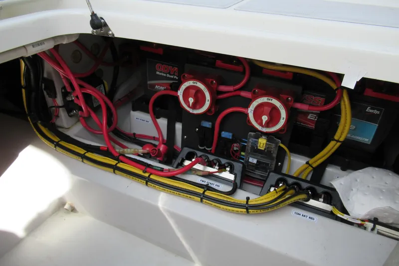Slide: The Image of Electrical system of a 2017 Ribcraft Express 32 boat with wiring and battery switches. - 14