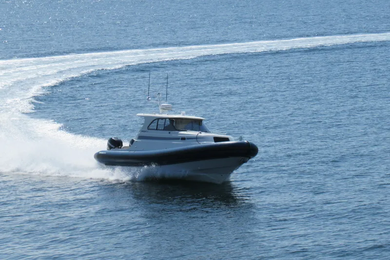 Slide: The Image of 2017 Ribcraft Express 32 cruising swiftly on open water. - 2