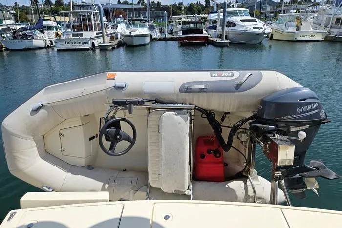 Slide: The Image of Inflatable boat with Yamaha motor docked near Mainship 34 Trawler, 2007 model. - 22