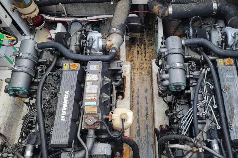 Slide: The Image of Engine compartment of a 2000 Stamas 310 Express boat with dual Yanmar engines. - 10