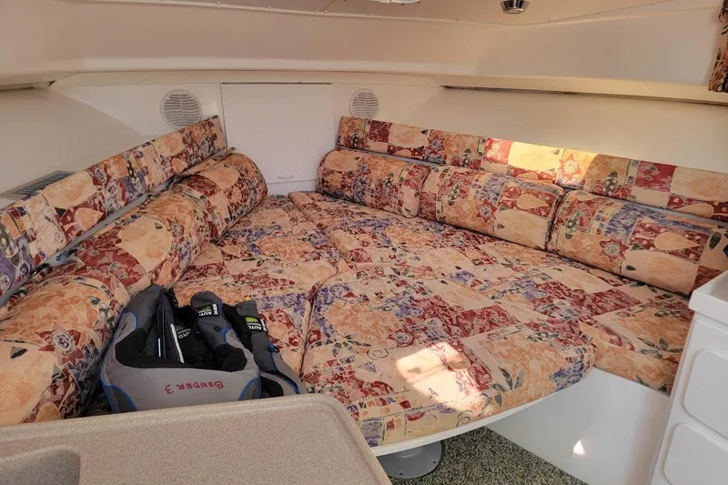 Slide: The Image of Interior cabin of 2000 Stamas 310 Express with colorful patterned seating. - 16