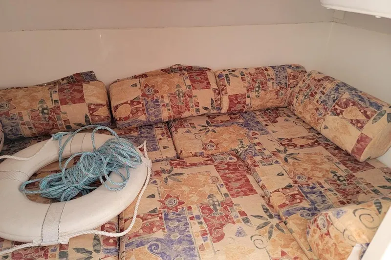 Slide: The Image of Interior of 2000 Stamas 310 Express boat with patterned seating and life preserver. - 22