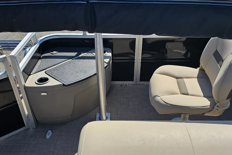 Slide: The Image of 2024 Sun Tracker SportFish 20 DLX interior with seating and storage area. - 15