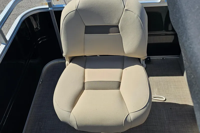 Slide: The Image of 2024 Sun Tracker SportFish 20 DLX boat seat, beige upholstery, on deck. - 16