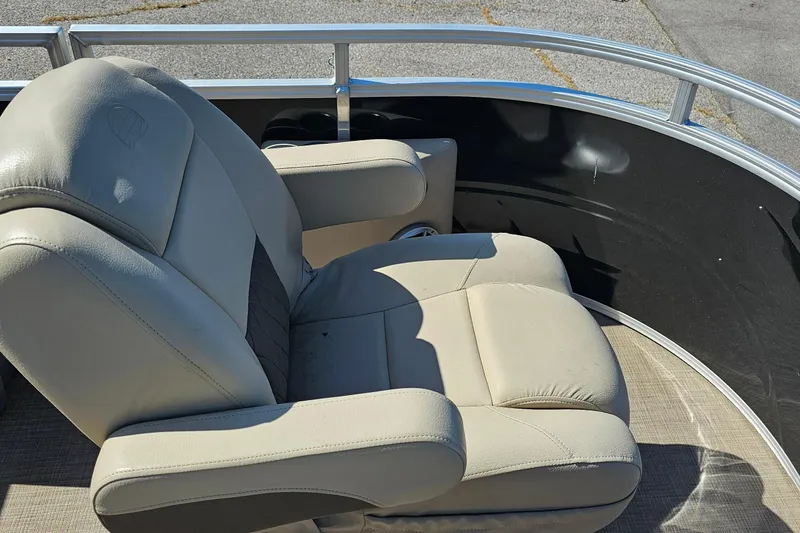 Slide: The Image of 2024 Sun Tracker SportFish 20 DLX boat seat with beige upholstery and armrests. - 6