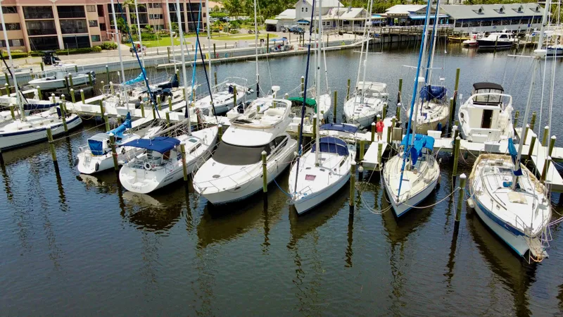 The Image of Boats docked at a marina, featuring a 2005 Catalina 36 sailboat. - 0