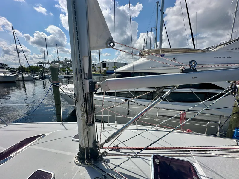 Slide: The Image of 2005 Catalina 36 sailboat mast and rigging at marina, under a partly cloudy sky. - 12