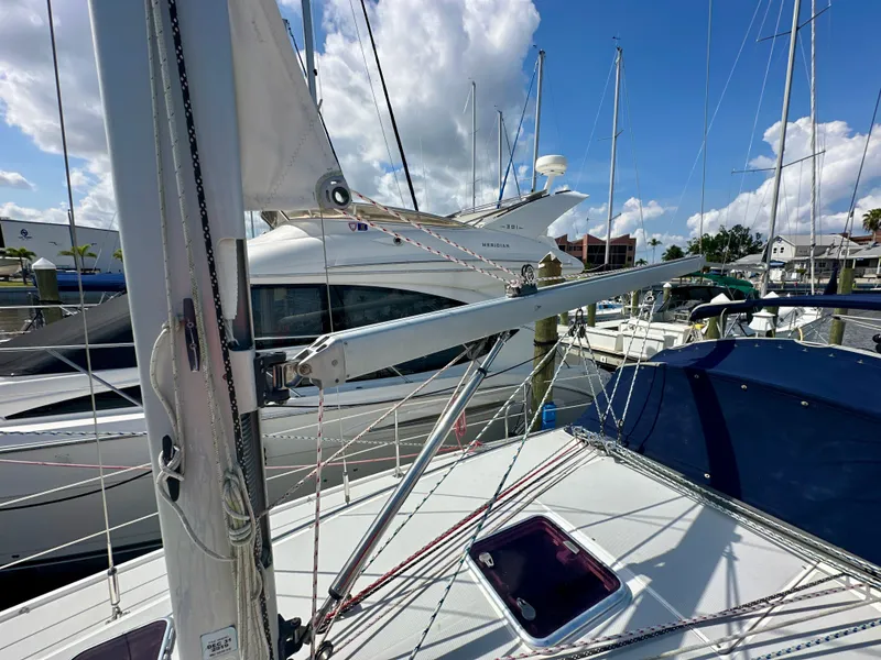 Slide: The Image of Sailboat deck view of 2005 Catalina 36 in marina, with clear skies and surrounding boats. - 14