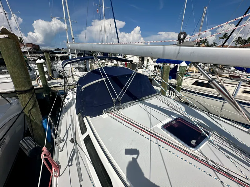 Slide: The Image of 2005 Catalina 36 sailboat docked at marina under clear blue sky. - 15