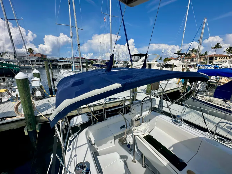 Slide: The Image of Sailboat Catalina 36, 2005 model, docked at marina under clear blue sky. - 17