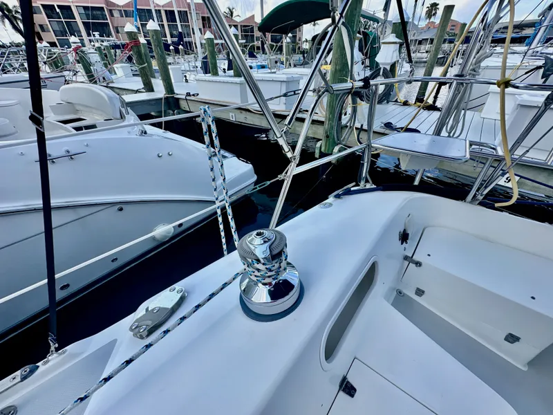 Slide: The Image of 2005 Catalina 36 sailboat docked at marina, featuring deck and winch details. - 24