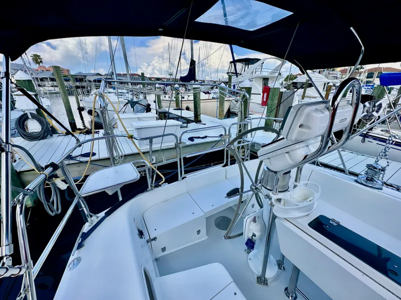 Slide: The Image of Cockpit view of a 2005 Catalina 36 sailboat docked at a marina. - 25