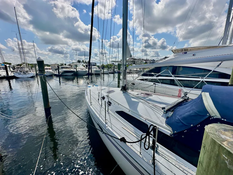 Slide: The Image of Catalina 36 sailboat docked at marina under a partly cloudy sky, 2005 model. - 3