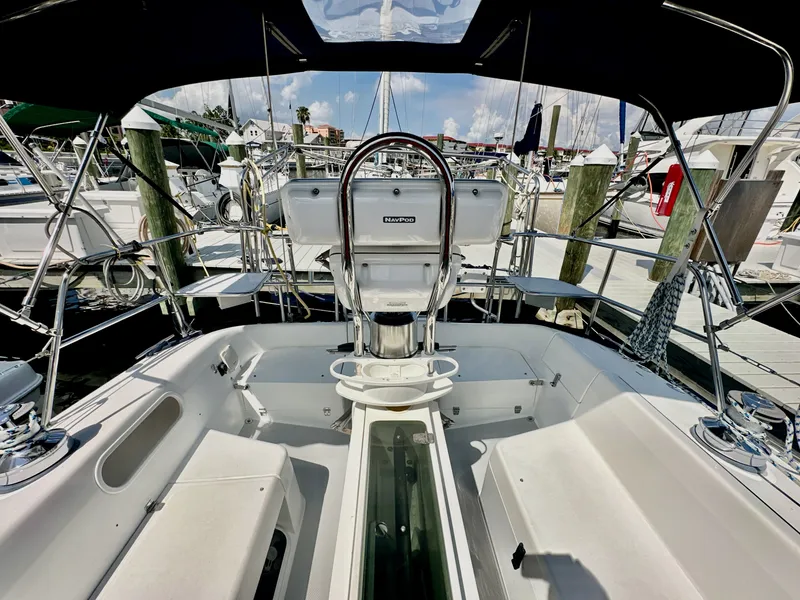 Slide: The Image of Cockpit view of a 2005 Catalina 36 sailboat docked at a marina. - 33