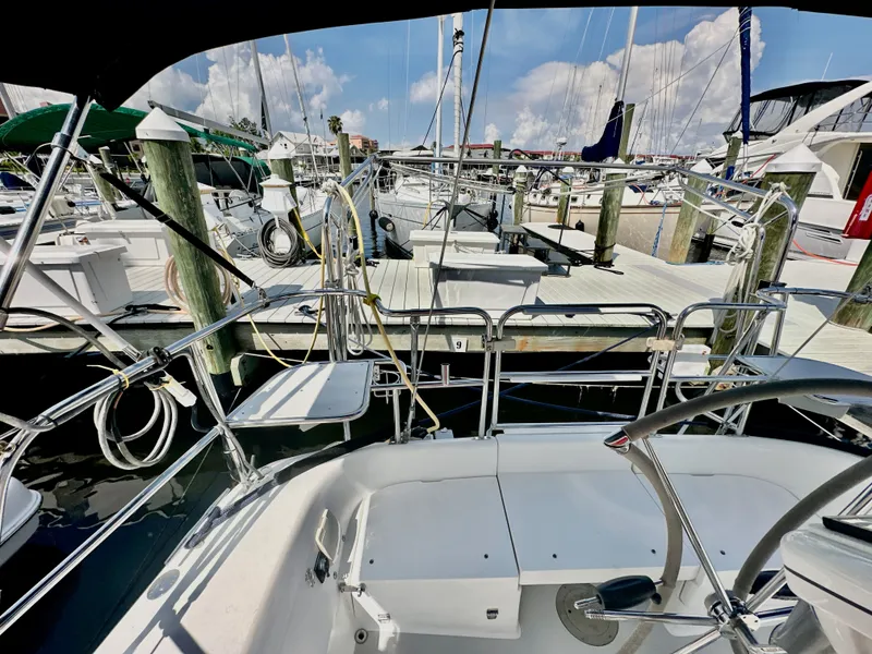 Slide: The Image of Cockpit view of a 2005 Catalina 36 sailboat docked at a marina. - 34
