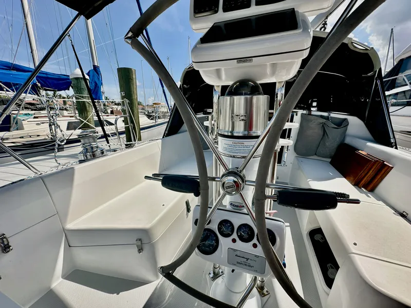Slide: The Image of Cockpit of a 2005 Catalina 36 sailboat with steering wheel and navigation instruments. - 35