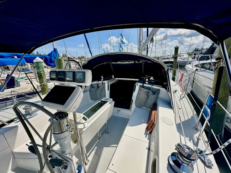 Slide: The Image of Cockpit view of a 2005 Catalina 36 sailboat docked at a marina. - 36