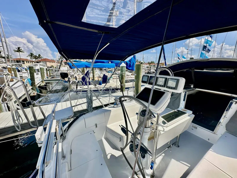 Slide: The Image of Cockpit view of a 2005 Catalina 36 sailboat docked at a marina. - 37