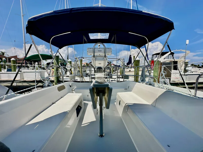 Slide: The Image of 2005 Catalina 36 sailboat cockpit with blue canopy, docked at marina. - 39