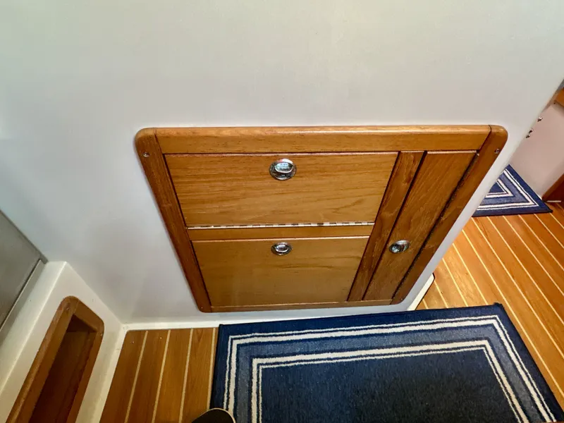 Slide: The Image of Wooden cabinet with chrome handles on a Catalina 36 yacht, 2005 model. - 48