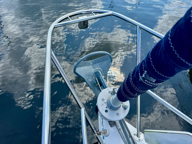 Slide: The Image of Bow of a 2005 Catalina 36 sailboat with anchor over reflective water. - 5