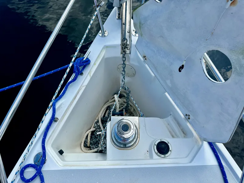 Slide: The Image of Anchor locker of a 2005 Catalina 36 sailboat with ropes and chains. - 7